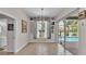 The dining area offers views and access to the backyard pool through sliding glass doors at 2332 Timbergrove Dr, Valrico, FL 33596