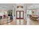 Grand foyer with high ceilings, decorative chandelier, and view to the dining and living areas at 2332 Timbergrove Dr, Valrico, FL 33596
