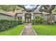 Charming home exterior with lush landscaping, a welcoming entryway, and a well-maintained lawn at 2332 Timbergrove Dr, Valrico, FL 33596
