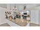 Bright kitchen with granite countertops, stainless steel appliances, and modern lighting fixtures at 2332 Timbergrove Dr, Valrico, FL 33596