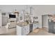 Open-concept kitchen with an island and views of living room and fireplace at 2332 Timbergrove Dr, Valrico, FL 33596