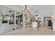 Open kitchen and dining area with stainless steel appliances, an island, and screened-in lanai access at 2332 Timbergrove Dr, Valrico, FL 33596