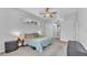 The main bedroom has a ceiling fan, a window, and neutral walls with access to en-suite bathroom at 2332 Timbergrove Dr, Valrico, FL 33596
