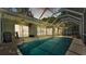 Relaxing screened pool area with ceiling fans and outdoor furniture, perfect for entertaining at 2332 Timbergrove Dr, Valrico, FL 33596