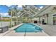 A beautiful screened-in pool area with a clean pool and large deck at 2332 Timbergrove Dr, Valrico, FL 33596