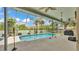 A beautiful screened-in pool area with a clean pool and large deck at 2332 Timbergrove Dr, Valrico, FL 33596