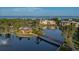 Breathtaking aerial view of a community showcasing a lake, bridge, and lush landscaping at 23465 Harborview Rd # 223, Punta Gorda, FL 33980