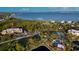 Picturesque aerial view of the property showcasing community amenities like pool, and tennis courts at 23465 Harborview Rd # 223, Punta Gorda, FL 33980