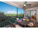 Inviting screened balcony offers peaceful views of lush greenery, perfect for relaxation and entertaining at 23465 Harborview Rd # 223, Punta Gorda, FL 33980