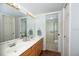 Bright bathroom features a double sink vanity, plenty of storage, and a separate shower room at 23465 Harborview Rd # 223, Punta Gorda, FL 33980