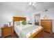 Well-lit bedroom showcases a matching dresser and nightstand, providing ample storage at 23465 Harborview Rd # 223, Punta Gorda, FL 33980