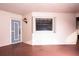 Bright condo entryway featuring a gray door with sidelight and a window allowing natural light at 23465 Harborview Rd # 223, Punta Gorda, FL 33980