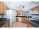 Functional kitchen with stainless steel microwave, white appliances, and ample counter space at 23465 Harborview Rd # 223, Punta Gorda, FL 33980