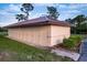 Image shows outside storage units in a building with metal roof and beige siding at 23465 Harborview Rd # 223, Punta Gorda, FL 33980
