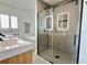 Beautiful bathroom featuring a glass shower, double vanity, and soaking tub at 320 Palm Ne Is, Clearwater Beach, FL 33767