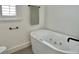Modern bathroom featuring a white spa tub with black hardware at 320 Palm Ne Is, Clearwater Beach, FL 33767
