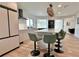 Modern kitchen featuring modern appliances, a center island, and stylish green bar stools at 320 Palm Ne Is, Clearwater Beach, FL 33767