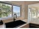 Modern kitchen sink with a view, showcasing a sleek design and scenic waterfront views at 320 Palm Ne Is, Clearwater Beach, FL 33767