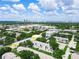 Aerial view of a residential property with a city skyline in the distance at 3811 N Oak Dr # E62, Tampa, FL 33611