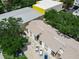 Aerial view of residential property with a courtyard and ample parking space at 3811 N Oak Dr # E62, Tampa, FL 33611
