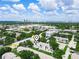 Aerial view of a residential property with a city skyline in the distance at 3811 N Oak Dr # E62, Tampa, FL 33611