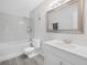 Bathroom featuring a shower over tub and updated vanity at 3811 N Oak Dr # E62, Tampa, FL 33611