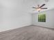 The bedroom has wood-look floors and a ceiling fan at 3811 N Oak Dr # E62, Tampa, FL 33611