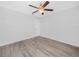 Empty bedroom featuring wood-look floors and a ceiling fan at 3811 N Oak Dr # E62, Tampa, FL 33611