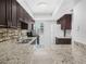 This is a beautifully remodeled kitchen with granite counters, tile backsplash, and stainless steel appliances at 3811 N Oak Dr # E62, Tampa, FL 33611