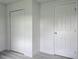Hallway view of paneled doors and a closet with bi-fold doors at 702 Hillsboro St, Plant City, FL 33563