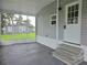 Screened patio offering a peaceful retreat with shaded outdoor living space at 702 Hillsboro St, Plant City, FL 33563