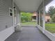 Enclosed patio providing a shaded outdoor living area with a view of the backyard at 702 Hillsboro St, Plant City, FL 33563