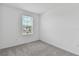 Bright bedroom with grey carpet and large window at 5711 Tripoli Dr, Palmetto, FL 34221