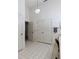 Clean and bright bathroom with double doors and tile floors at 13473 Bruni Dr, Spring Hill, FL 34609