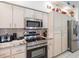 Modern kitchen featuring stainless steel appliances and granite countertops at 13473 Bruni Dr, Spring Hill, FL 34609
