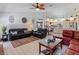 Comfortable living room featuring leather furniture and large windows at 13473 Bruni Dr, Spring Hill, FL 34609
