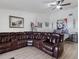 Relaxing living area with sectional sofa and large windows at 13473 Bruni Dr, Spring Hill, FL 34609