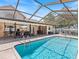 Inviting screened pool area with ample patio space for relaxation at 13473 Bruni Dr, Spring Hill, FL 34609