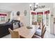 Bright dining area with wood table and chairs near kitchen at 13473 Bruni Dr, Spring Hill, FL 34609