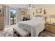 Bright bedroom with a queen-size bed and large window at 13473 Bruni Dr, Spring Hill, FL 34609