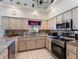 Spacious kitchen featuring granite countertops and stainless steel appliances at 13473 Bruni Dr, Spring Hill, FL 34609