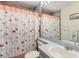 Clean bathroom with shower/tub combo and updated vanity at 13473 Bruni Dr, Spring Hill, FL 34609