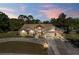 Two-story house with large driveway and landscaping at 13473 Bruni Dr, Spring Hill, FL 34609