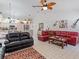 Open living room with comfortable seating and view to kitchen at 13473 Bruni Dr, Spring Hill, FL 34609