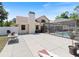 Large backyard with patio, pool, and cornhole game at 13473 Bruni Dr, Spring Hill, FL 34609