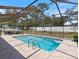 Relaxing screened pool with patio furniture at 13473 Bruni Dr, Spring Hill, FL 34609