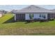 Home with screened-in patio and grassy backyard at 18039 Cherished Loop, Bradenton, FL 34211
