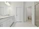Clean bathroom with white cabinets, toilet and a walk-in shower at 18039 Cherished Loop, Bradenton, FL 34211