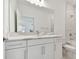 Bright bathroom with white cabinets and quartz countertops at 18039 Cherished Loop, Bradenton, FL 34211