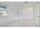 Bedroom with window and access to another room at 18039 Cherished Loop, Bradenton, FL 34211